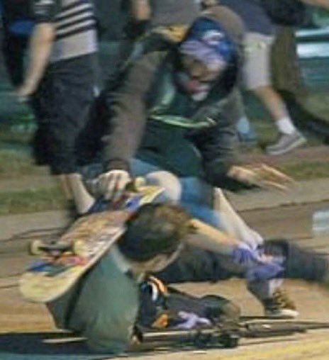 This is the masked man with a skateboard hitting the armed person on the ground a split second before he presumably gets shot. I don’t know if he is one of the two that died.  #KenoshaRiots