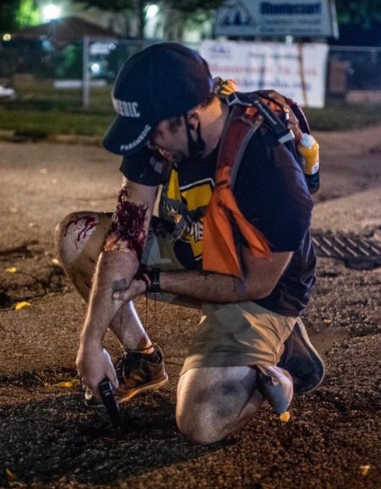 Here's the image of the guy with the pistol that was shooting at the shooter. (2nd victim) Sorry I don't know the original photographer to credit them.