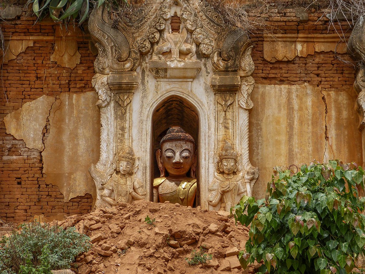 This too shall pass. In northern Myanmar, a statue of Buddha sits in contentment while the pagoda around it crumbles and decays. Photo from my book #VanishingAsia #Buddha #Myanmar