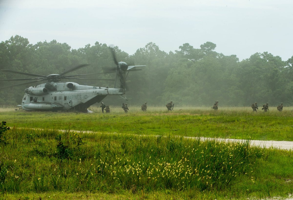 Marines with 3rd Battalion, 6th Marine Regiment, 2nd Marine Division, exit a CH-53 Super Stallion helicopter during Exercise Deep Water at Camp Lejeune, N.C., July 29, 2020. Photo By: Marine Corps Cpl. Elijah J. Abernathy