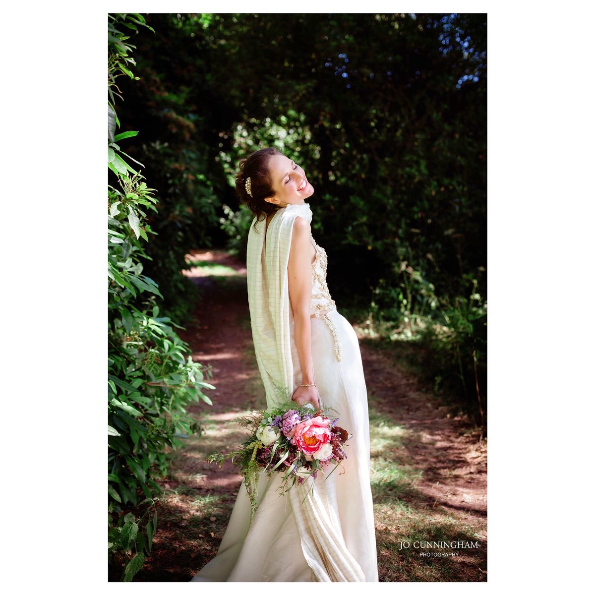 Devon wedding photographer: happy stylish bride in Powderham Castle’s American Garden #devon #DevonHour #devonweddingphotographer #devonweddingvenue #WeddingHour