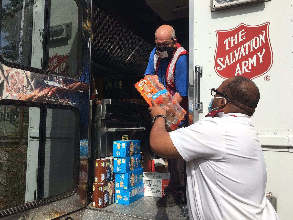 Lt. Jamaal Ellis, right, helps load food, drinks and snacks on the mobile canteen for emergency disaster services deployment after Hurricane Laura makes its way through Louisiana Thursday.