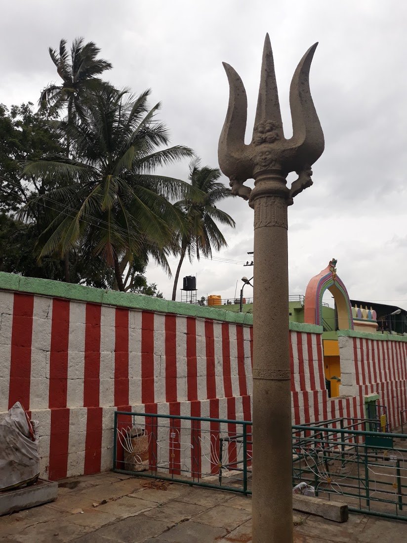 -Gavi Gangadhareshwara Temple,Gavipuram,Near BasavanagudiInner sanctum is situated inside a cave carved in rock. Courtyard has monolithic sculptures-Suryapana & Chandrapana-each consisting of a massive disc atop a supporting pillar.2 more pillars with trishul & Damaru.2/n