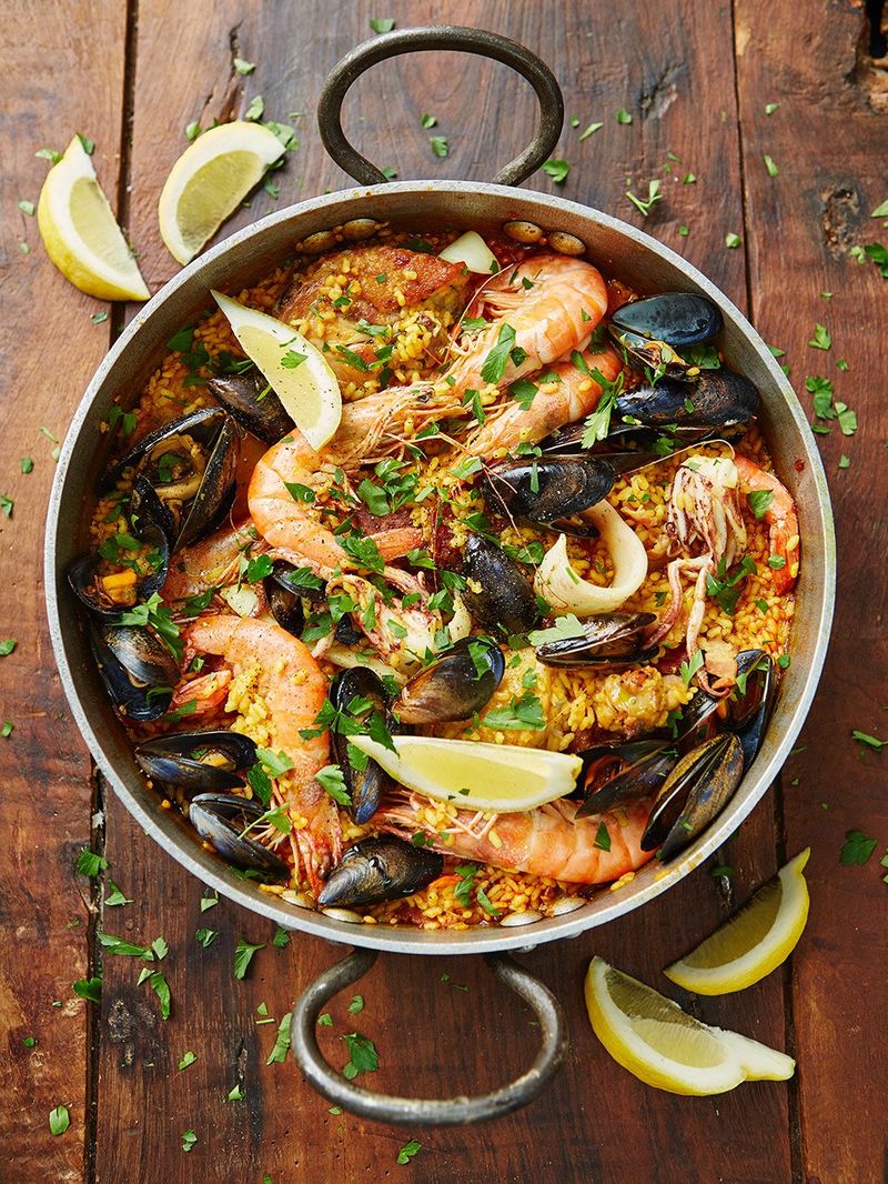 here, for instance - study the prawn at 3 o'clock on the left-hand picture (hairy bikers paella) - it's patently the same as the lowest one beneath the lemon in the pic on the right (jamie oliver)