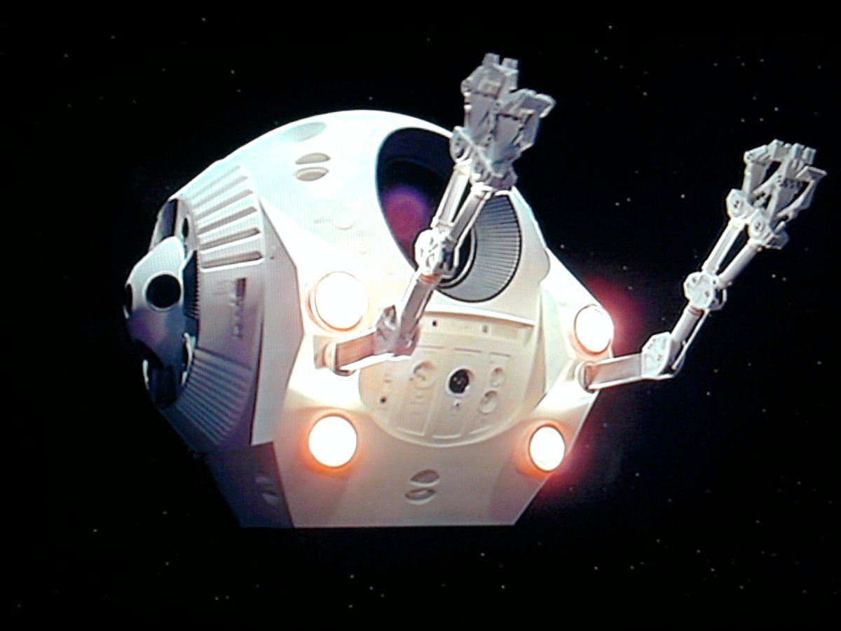 2001 A Space Odyssey had pods—miniature spacecraft with flexible arms, while on both the Shuttle and the International Space Station we have Canadarm serving the same purposecredit: MGM & Canadian Space Agency