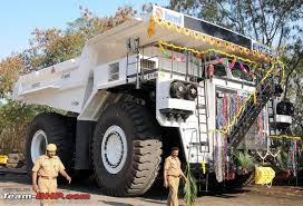 As I said in the morning, it makes it worse when we know BEML (Bharat Earth Movers Ltd) B'lore was set up in 1964, precisely to manufacture large Dumper Trucks, Excavators, and the like in the Public Sector. They do make advanced versions as shown in (1) vs the ordinary ones (2)