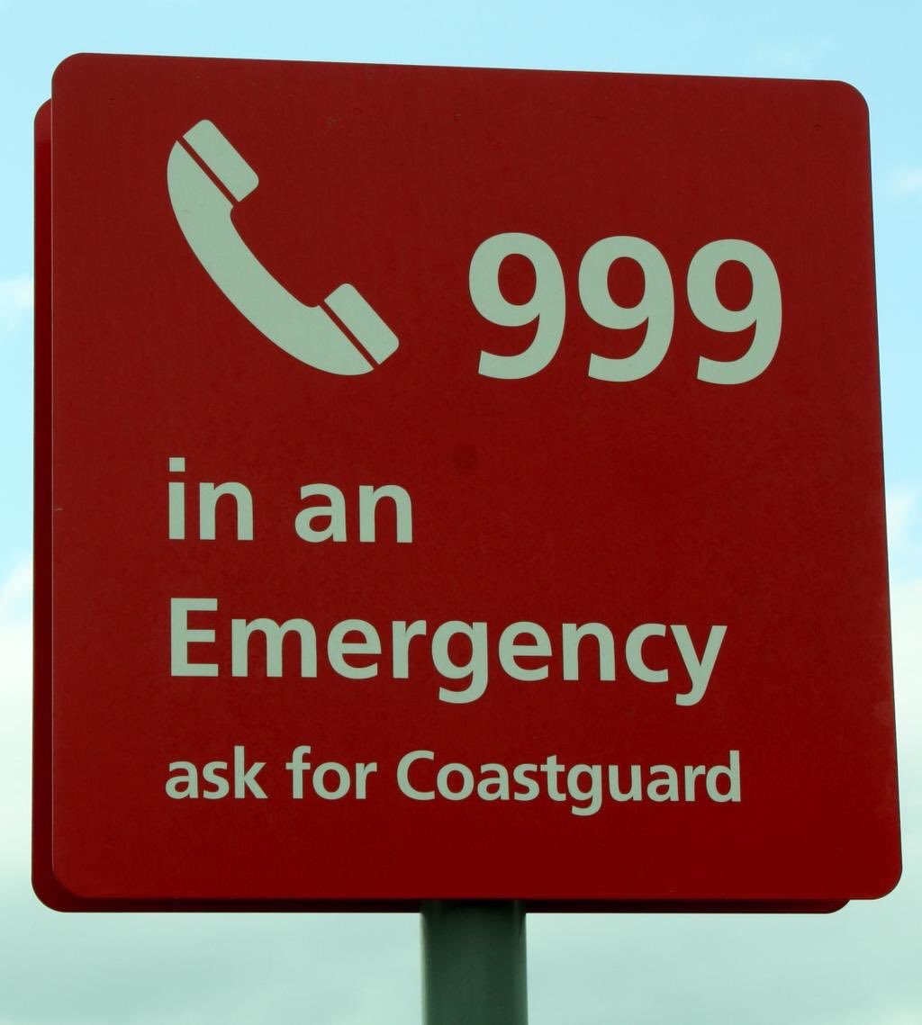 First off, in any coastal emergency call 999 and ask for the Coastguard. @HMCoastguard will co-ordinate an appropriate response, which may be a lifeboat or a Coastguard Rescue Team. It is better to call if you are unsure, as the units can be stood down if no longer required.