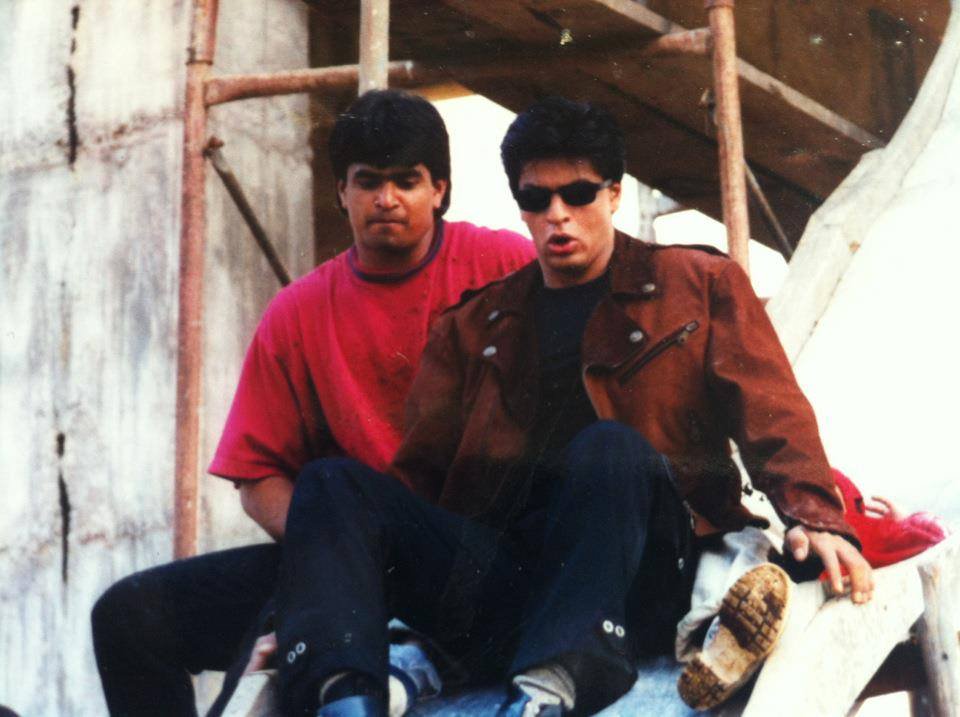 Time for a slide! #ShahRukhKhan on the sets of Baadshah 🎬 #21YearsOfBaadshah