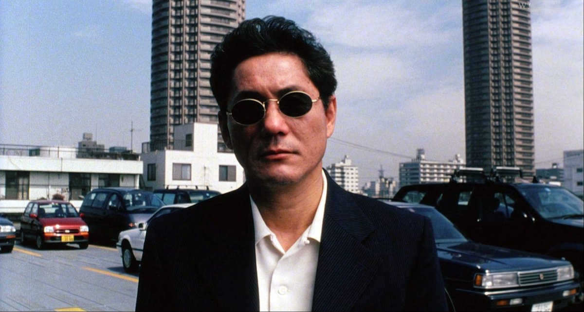 Takeshi Kitano (aka Beat Kitano) - known by many for Johnny Mnemonic and Battle Royale and by others for Takeshi's Castle. He is both an actor and director as well as comedian. Check out - "Taboo", "Sonatine", "Zatoichi", and "Kikujiro".