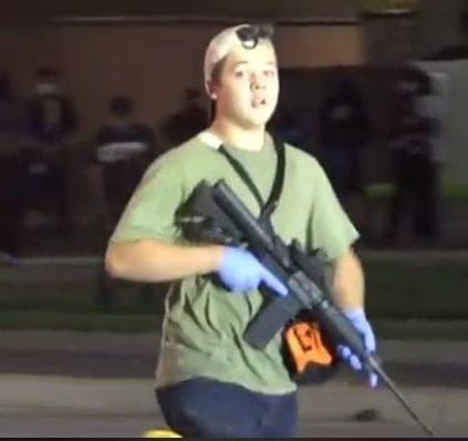 recte44's tweet image. If this individual with a long rifle had happened to have black skin, would he have been able to walk right by police? Would he have been given a cold water and thanked by police for being there? The answers explain the issue simply/logically #BlackLivesMatter #Equality #Kenosha
