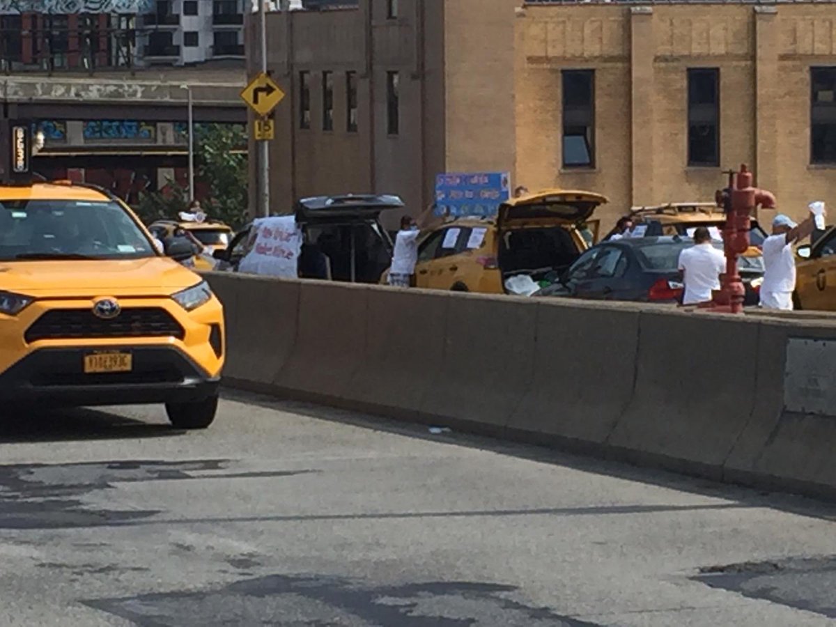 NYTWA's tweet image. SHUT IT DOWN! Yellow cab drivers are protesting on the Queens Borough Bridge demanding debt relief so we can live!