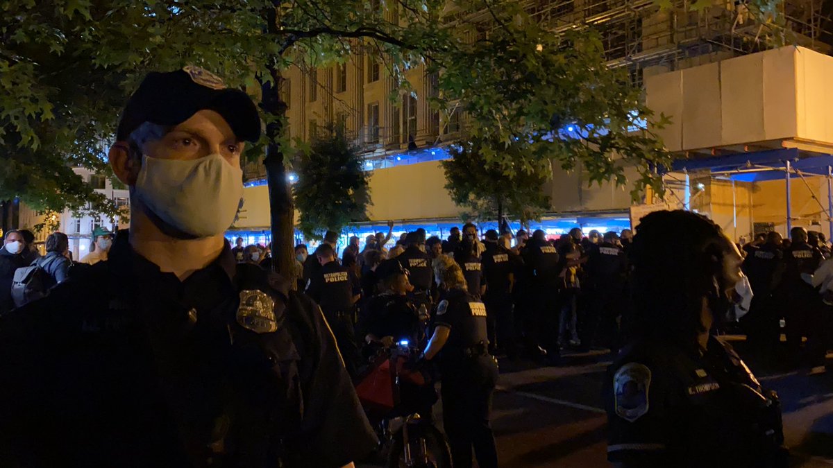 Allegedly white conservatives were verbally harassing protesters to start a fight. Police allegedly blocked them off to let the conservatives through. This officer would not let me pass to an open space even when I showed my press credentials