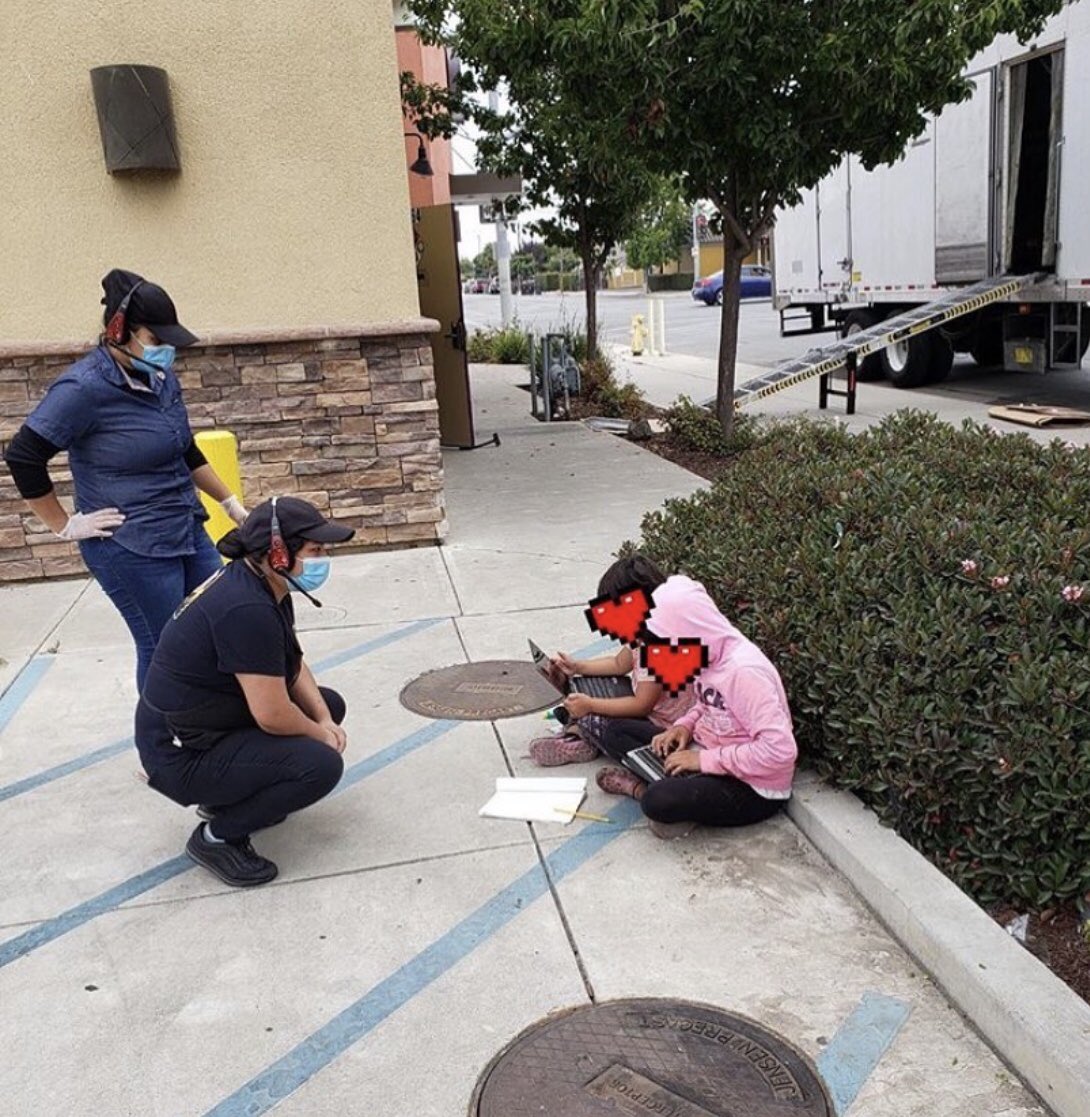 FutureDr_Drea's tweet photo. Two female students in front of a Taco Bell trying to access WiFi to finish their work. Let’s remember just because students are in a class, doesn’t mean they have access to all the resources. Not everyone has access to sustainable WiFi; it can be a luxury for some families. https://t.co/m0i5Pl99ZM
