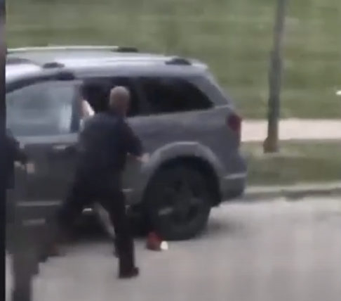 ...he continues going for the shirt. The car windows are tinted. If he wants to say he didn't see the kids, well...then how did he see what is in the car? No knife in the guys hand, at all. No pockets. The only person exhibiting violence escalation is the cop..