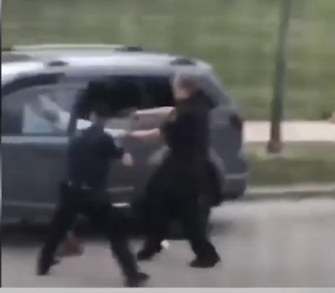 ...the time between the last image - pulling him back by the t-shirt - and this one, the first shot, is *less* than one second. Now, did he have a knife in his car? WTF cares? There is literally NO way these cops were threatened by a knife....