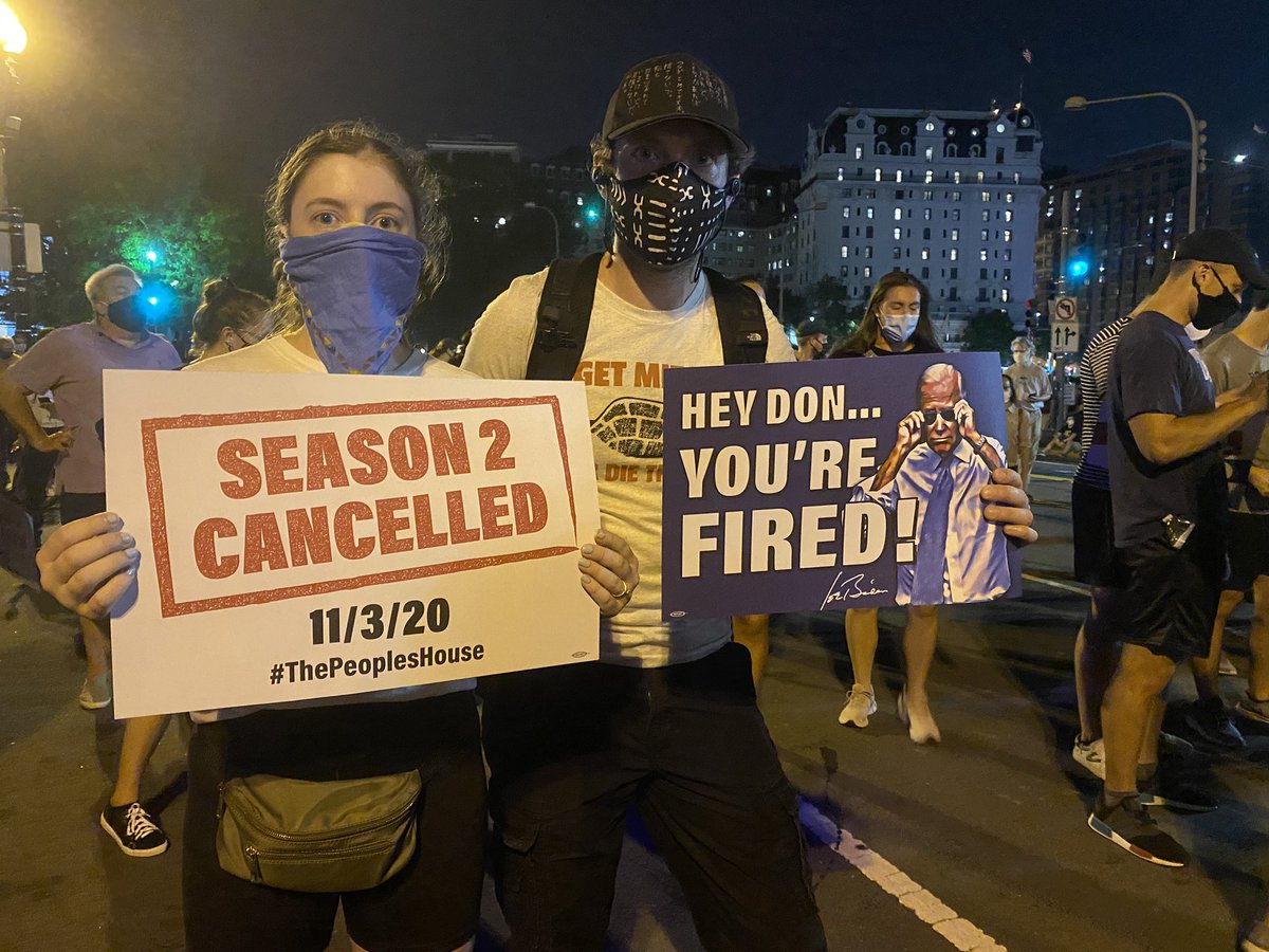 Individuals are passing out these double sided signs to almost every protester.  #DCProtests