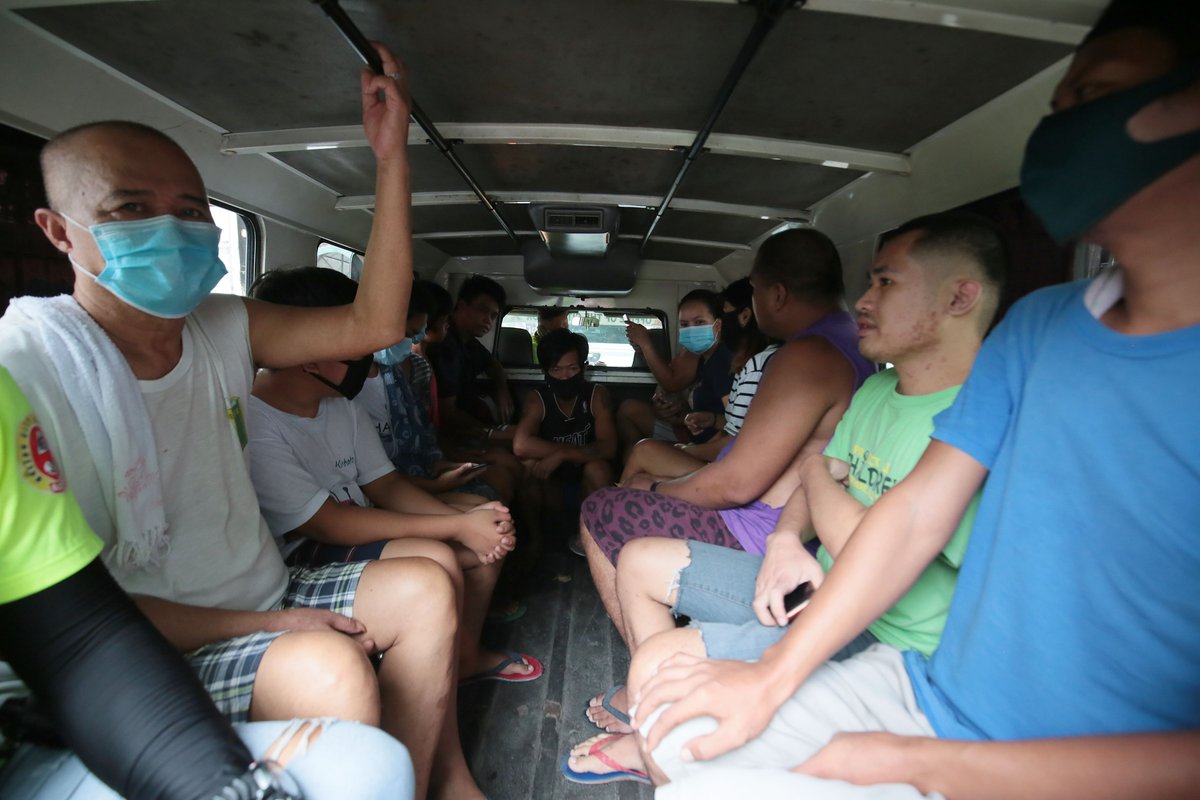 LOOK: Back in July, the police accosted health protocol violators in Quezon City.The violators were brought to a Task Force Disiplina office using a vehicle where they were unable to observe social distancing. They were fined P1,000 for first offense. STAR/Michael Varcas