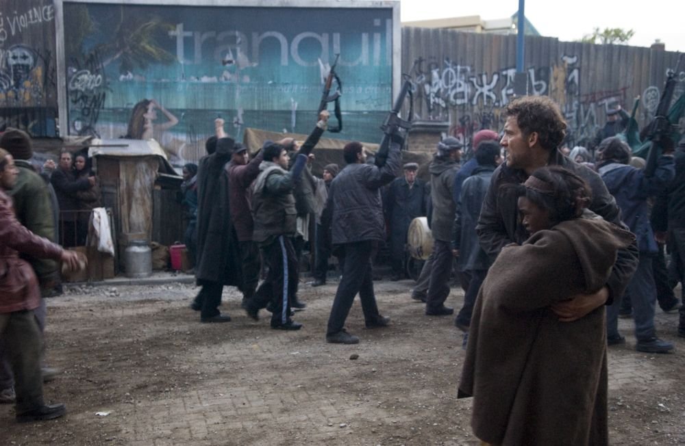 Children Of Men. Absurt scenario, what a nightmare. Women are not able to bear children. I feel like my heart died a few times this movie. The ''war'' scenes were amazingly shot. Favorite scene has to be them walking of the stairs. Great movie! Alfonso Cuarón  