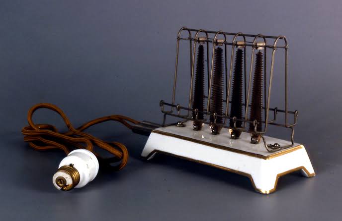 Let's go back to the beginning of the story. Earlier, the use of electricity was limited to lighting bulbs in houses. The bulbs were screwed into lamp holders.In 1904, Hubbell invented a plug that allowed non lighting devices to be screwed into lamp sockets. 2nd pic - toaster