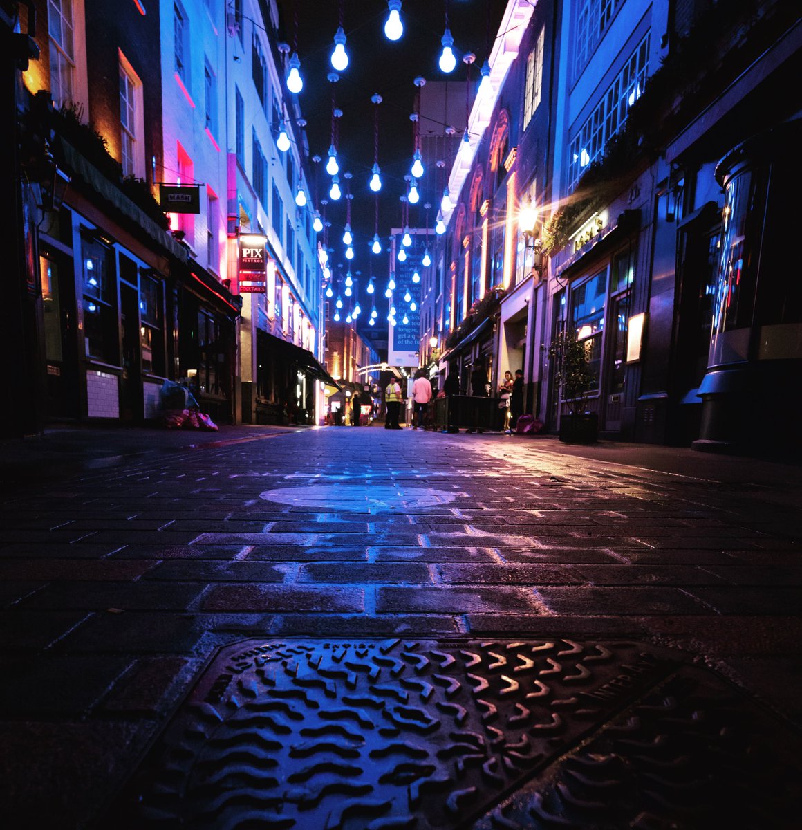 Carnaby Street, London #london #covidlondon #london2020 #carnabystreet #carnabystreetlondon #lights #bluelights #carnabystreetlights #manholecover #draincover #drain #night #nightphotography #summer