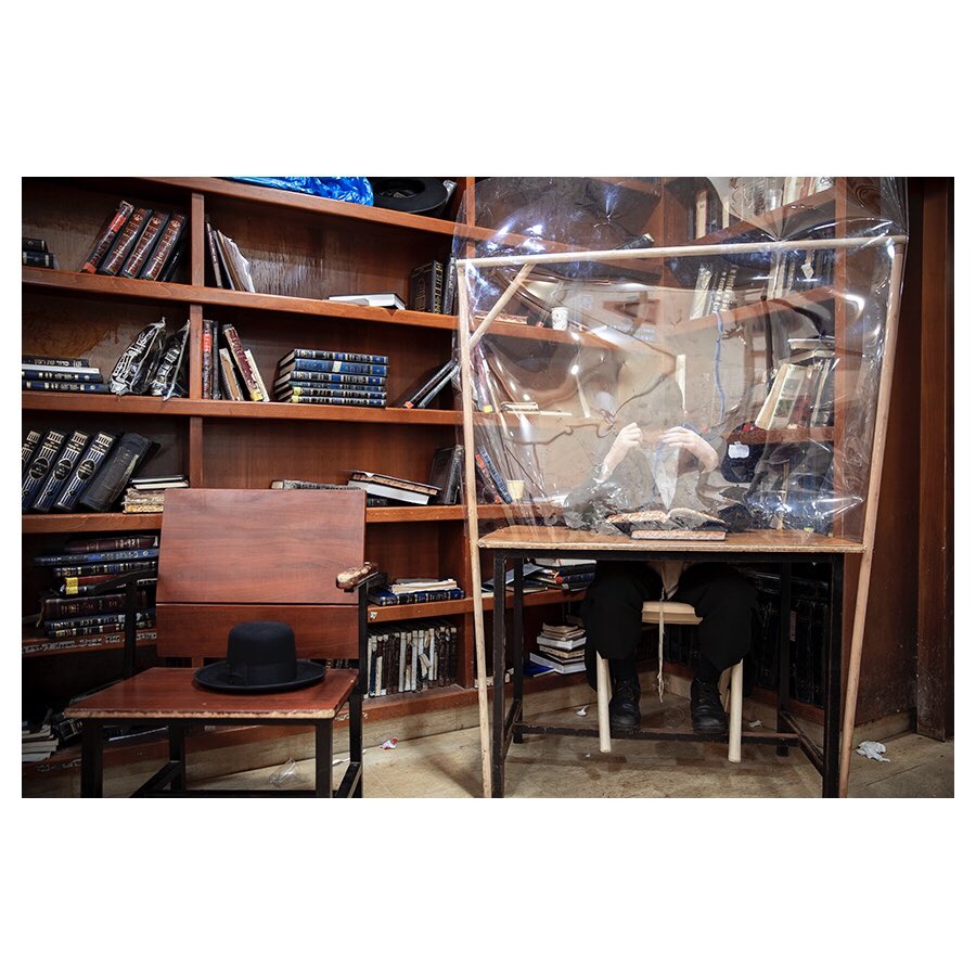 Ultra-Orthodox Jewish students study religious texts in a yeshiva, or Jewish seminary, using protective plastic shields set up amid the coronavirus pandemic, in Bnei Brak, Israel, Aug. 27, 2020. (AP Photo/Oded Balilty)