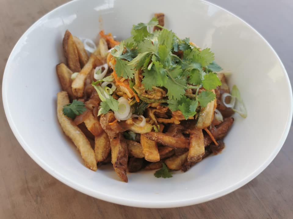 Our Pulled Pork Kimchi Poutine is #glutenfree and a must-try! It features our classic fries topped with house-made kimchi, pulled pork, turkey gravy, cheese curds, green onion and cilantro! Available for takeout or on our patio! #Kwawesome #explorewr #waterlooregion