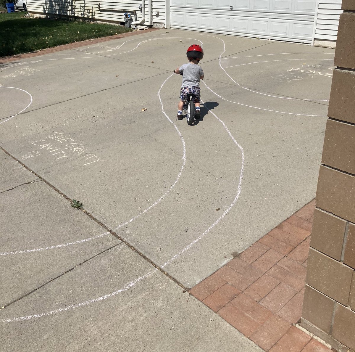 SECOND UPDATE: Neighbor just sent me this photo taken about an hour ago. Guy is still doing the chalk track, and the kid was there riding it! (Photo:  @Wonkatonk1)