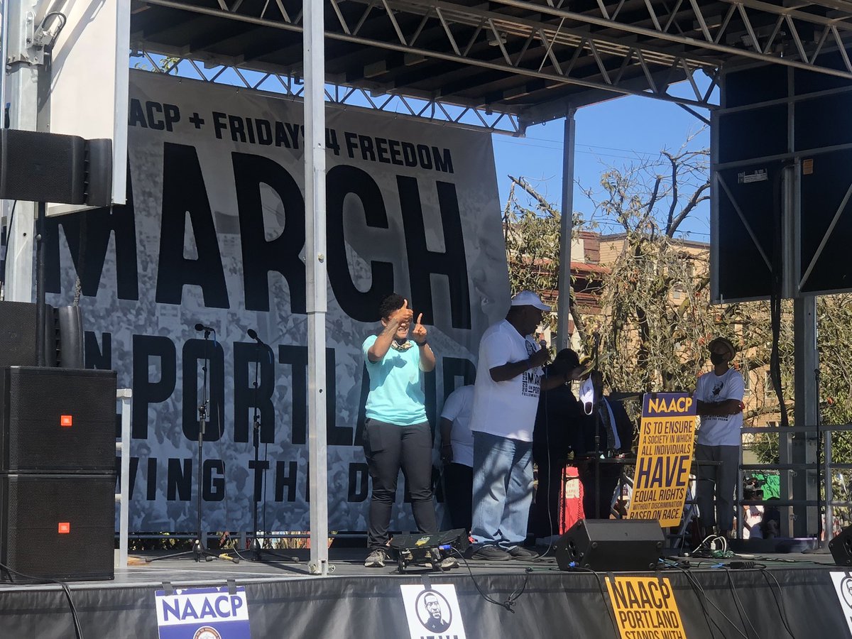 A poet addresses the crowd: “Enough with the anarchist rioting. Their voices have been heard ... Do not break windows. Do not throw things. Quoting the great Kanye West: ‘don’t do that.’”