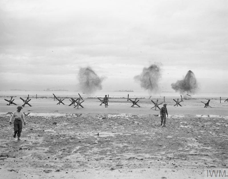 The first D-Day landings were planned to be just after low tide, when obstacles were exposed. Behind them came the LCOCU and Royal Engineer units. As the tide came in, LCOCU would work on obstacles as they were immersed, whilst the RE would work on the beach. IWM A 23993. 3/11
