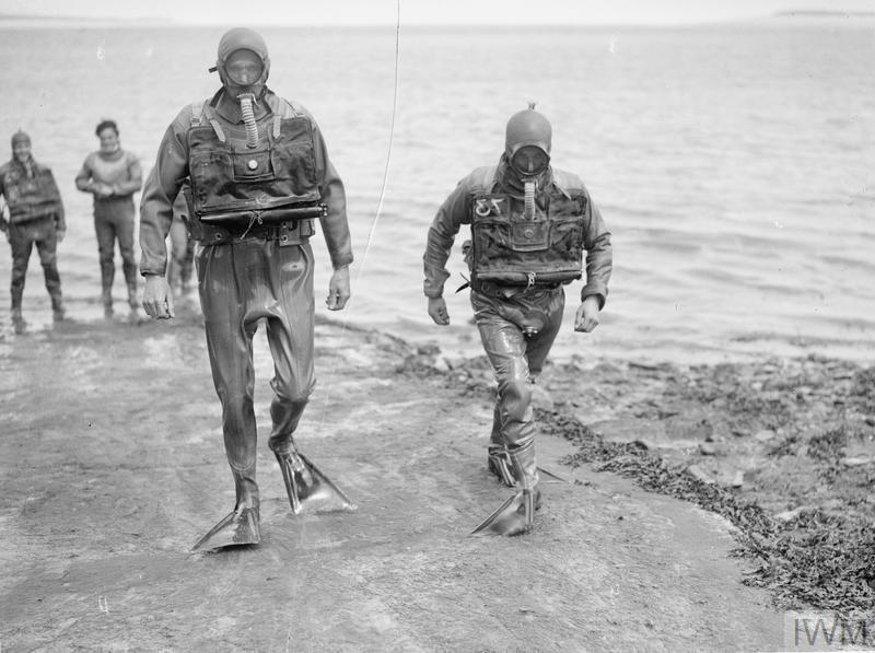 10 Landing Craft Obstacle Clearance Units (LCOCU) were at Normandy – 4 at Juno, 4 at Gold, 2 at Sword. Their role was to clear underwater obstacles & obstructions so landing craft could reach the beach. But they did it after the leading waves had touched down. IWM A28997. 2/11