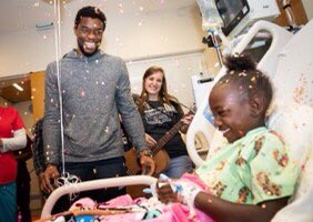 Chadwick had cancer and he visited and gave hope to children with cancer. Not all heros wear caps.