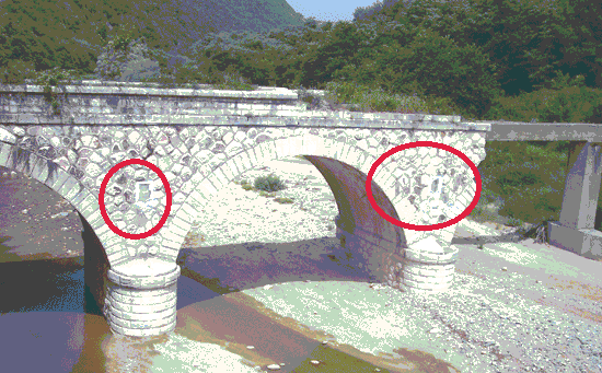 This is Hamidiye Bridge which was constructed in 1901 near İskeçe(Xanthi) city. First, the Turkish Crescent on the bridge was painted in colors of Greek flag then someone hammered&removed all these Crescent-stars, and probably in a few years, they gonna place a cross on that.