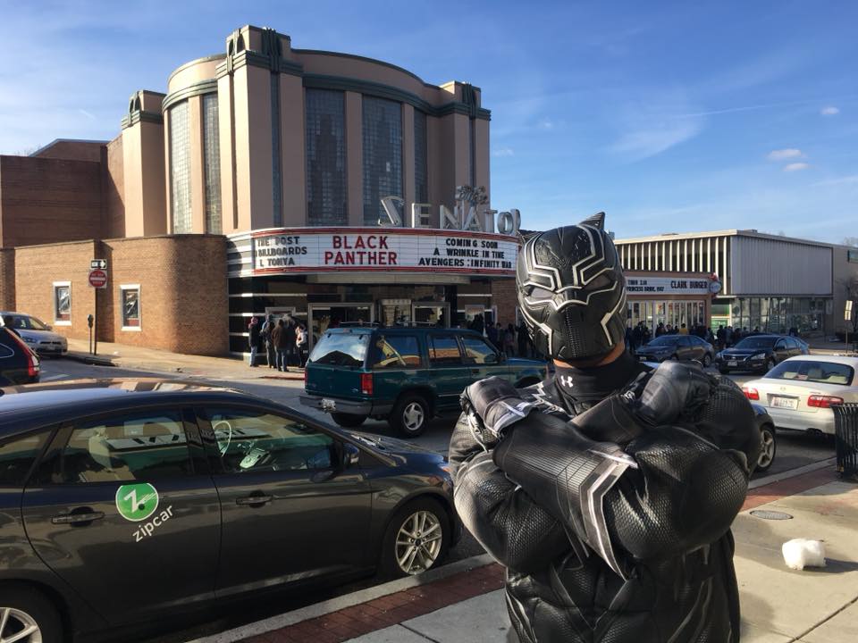 Carlsonics's tweet photo. #BlackPanther premiere, @HistoricSenator, '18, packed with #Baltimoreans, some in #cosplay. (I miss movie theatres!) My boy and I went together. People cheering, jeering at villains, crying to see a black hero... One of the most amazing experiences ever. RIP @chadwickboseman https://t.co/K6ynUXyhrM