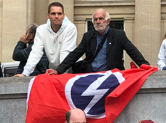Oh that's just a British Union of Fascists flag being openly flown at the QAnon/ David Icke/ general Tinfoil Hat Brigade demonstration in London.Seriously, truther scum use your fears over corps, banks and the government to hoodwink your into antisemitism and xenophobia. Avoid.