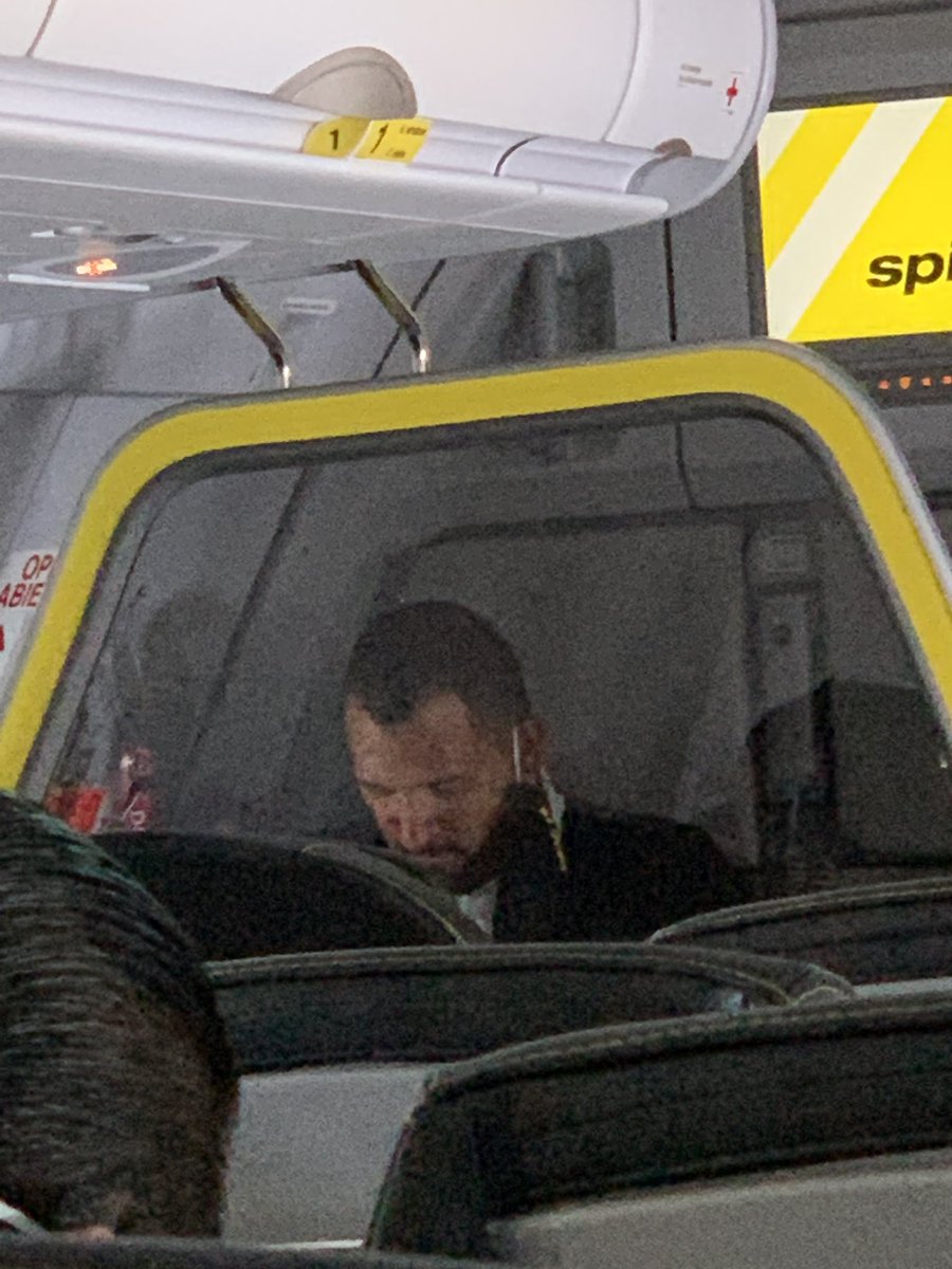 nancyhower's tweet photo. @SpiritAirlines won’t refund my money for my return flight even though they break their own Covid policies. Do not fly spirit airlines. Here are their flight attendants. Packed flight. No masks. Nightmare https://t.co/x58WYhL58K