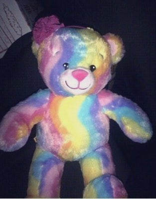 A person from this group hung a rainbow teddy bear on the stage. They say it was hung by @ bas0rexiaaa