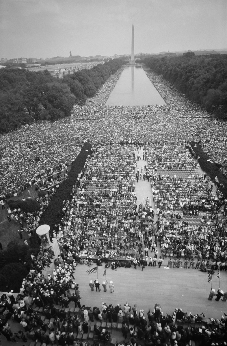 Black and white photograph of people gathered on the National Mall in Washington, DC for the March on Washington for Jobs and Freedom in 1963.