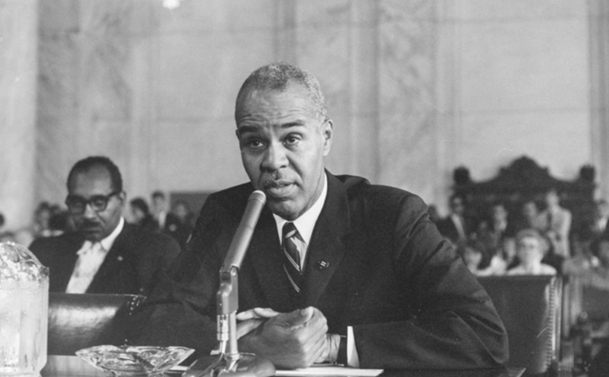 A photo of Roy Wilkins, one of our three founders, who appears to be testifying before Congress.