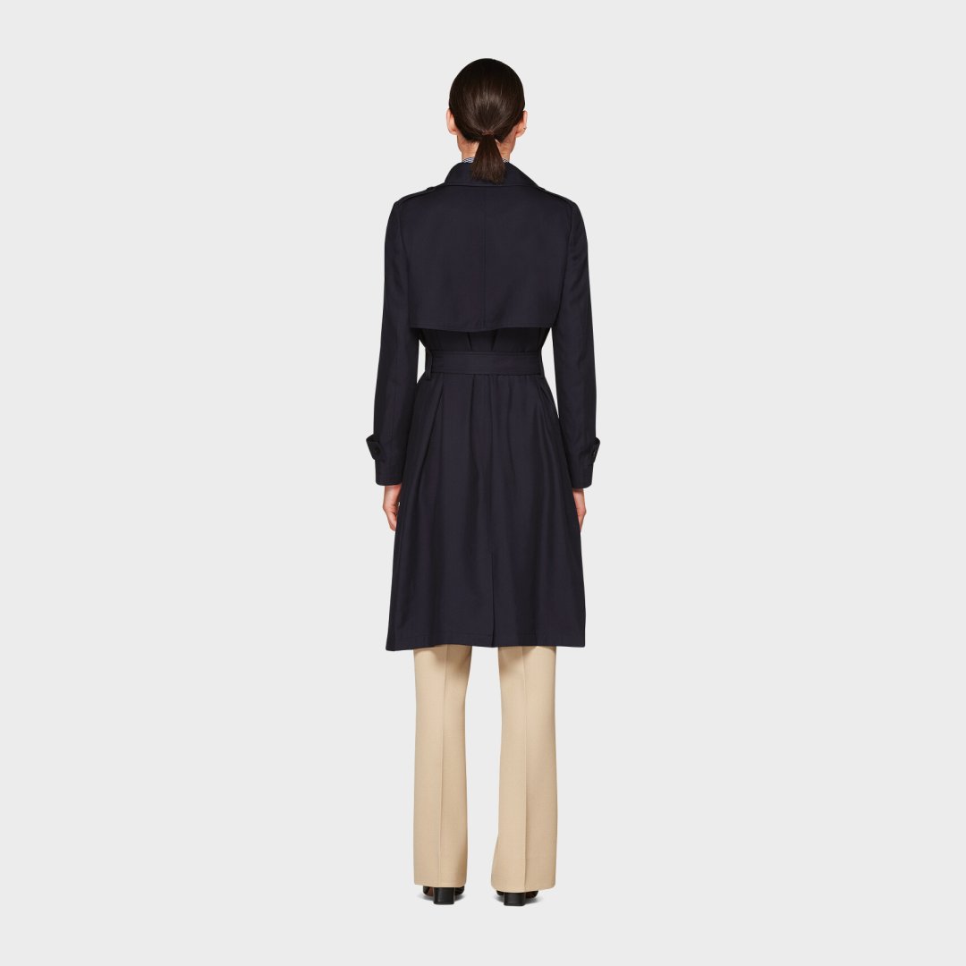 The essential navy trench for the seasonal transition. Shop the Quin coat at 40% off. #SUISTUDIO <-- suitsupp.ly/3jygUDf
