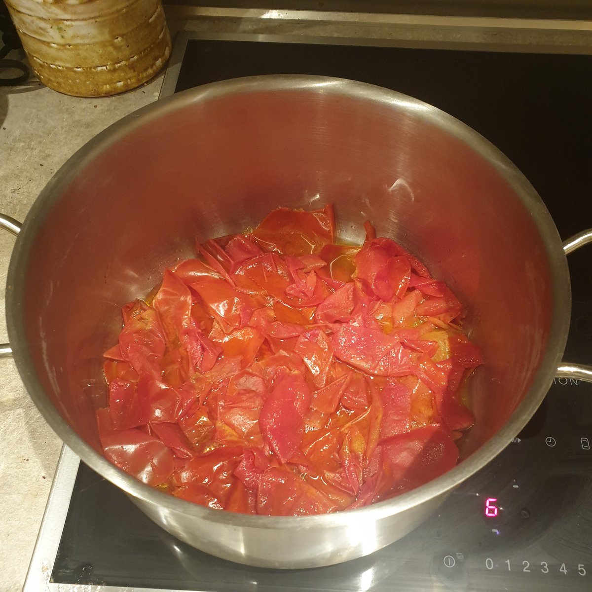 tomatoes blanched and peeled. save skinsroughly chop and liberally coat with salt. leave to sitpoach skins in olive oil on med low heat until oils have infused fully