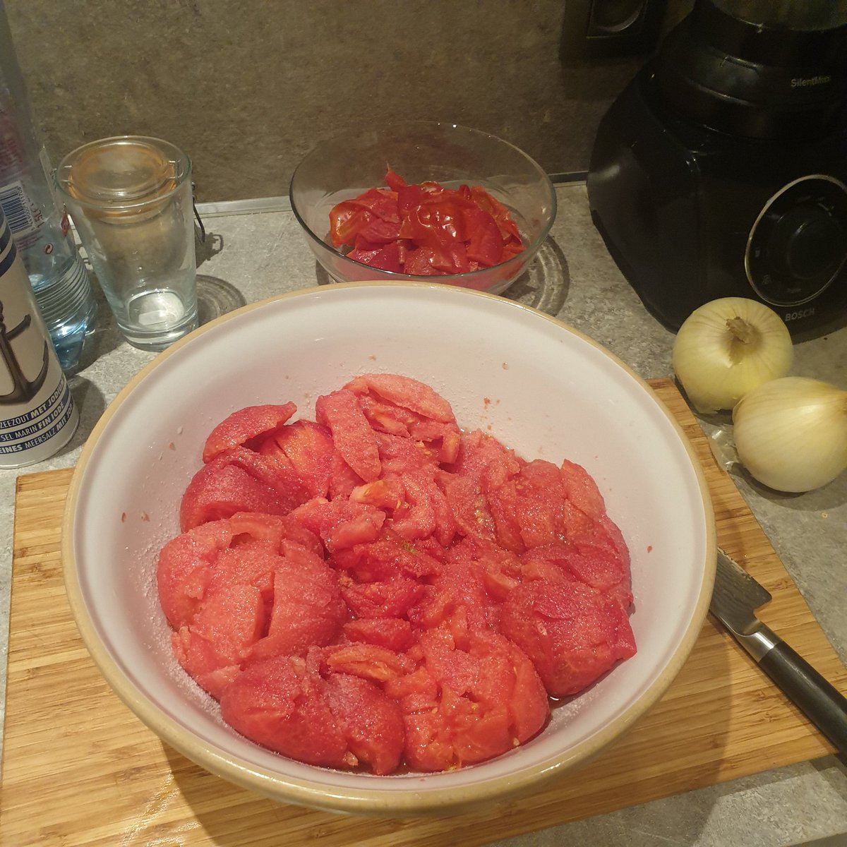 tomatoes blanched and peeled. save skinsroughly chop and liberally coat with salt. leave to sitpoach skins in olive oil on med low heat until oils have infused fully