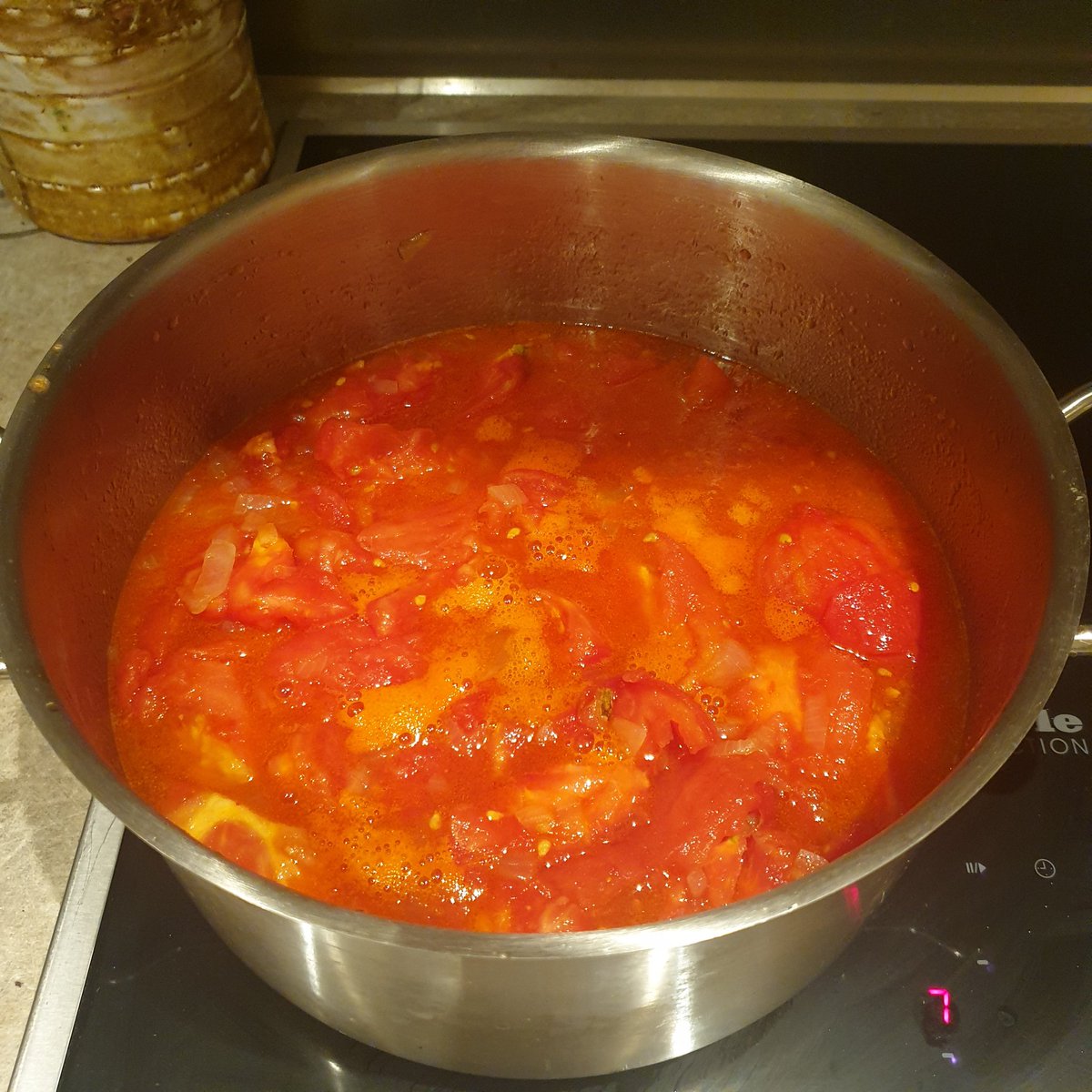 keep that heat low, and stir, stir stir. you see that bright orange foam? thats the tomato oil doing its work on the flesh. now we let the flavours develop. Slowly