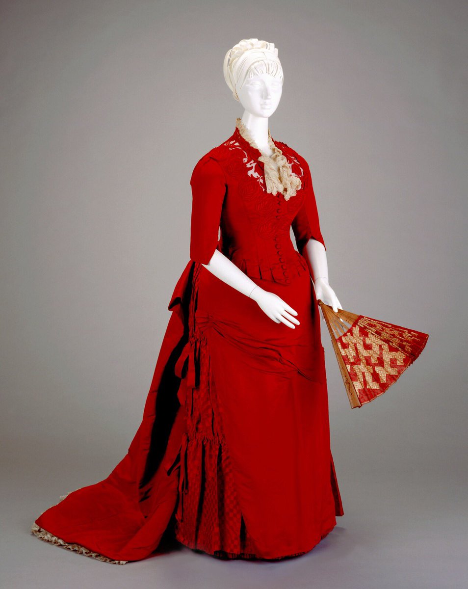 kateStrasdin's tweet photo. A mid #1880s reception dress that is just the shade of red as the #hawthorn berries that are crowding the hedges around us now. I might have to try making some hawthorn brandy for the first time, a warming tipple to banish chills @cincyartmuseum #fashionhistory https://t.co/Kblv4uyubx