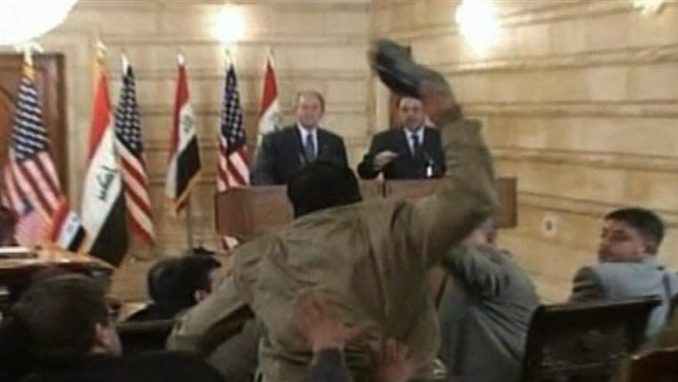 3. Iraqi reporter Muntazer Zaidi throws shoes at George W. Bush, Baghdad 2008