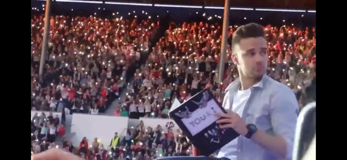 at first the others were singing and only Iiam was reading the book, then Iiam looked at Iouis and he joined him