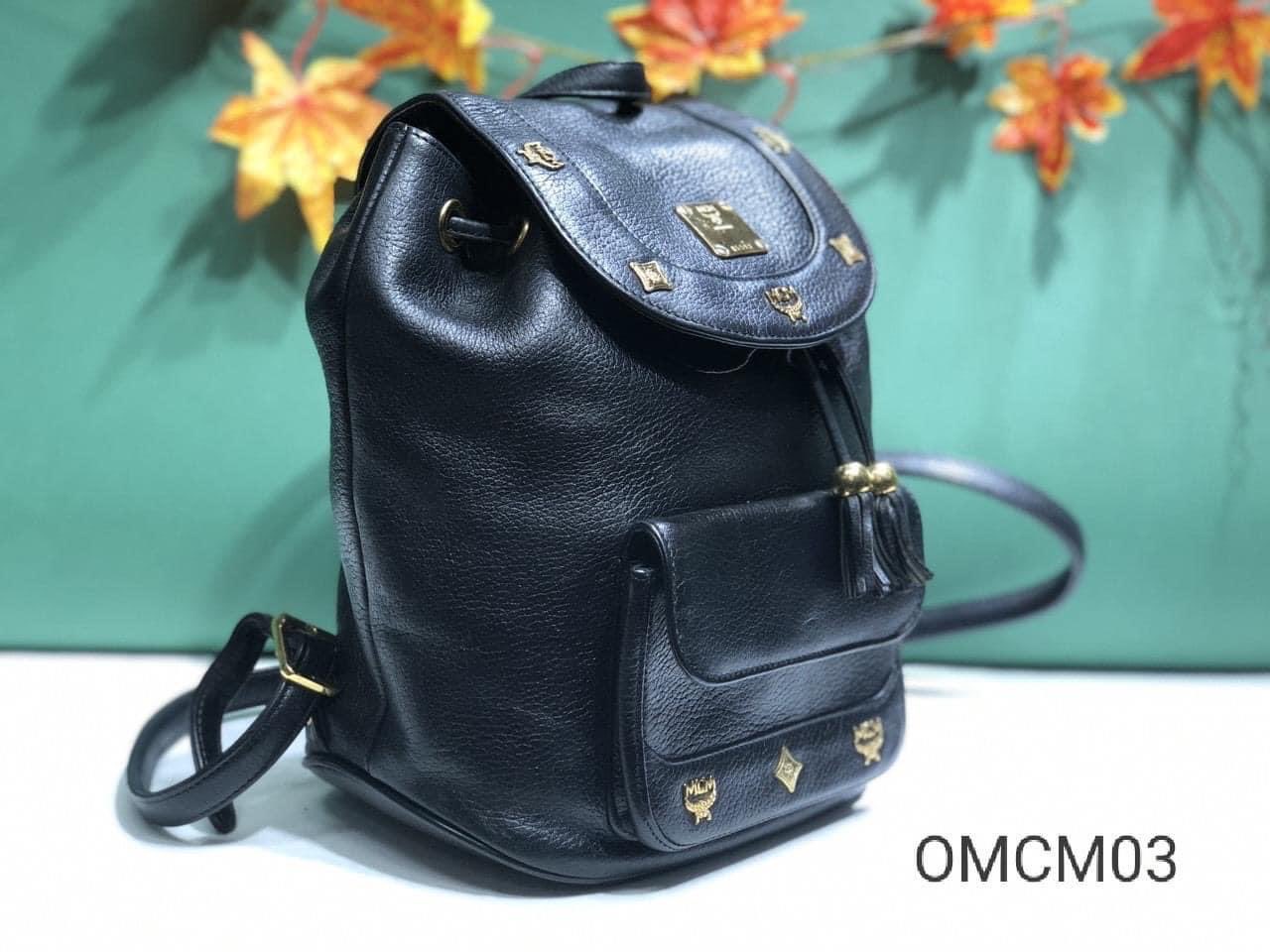 Vintage MCM Black Backpack With Golden Studded Logo Motifs and 