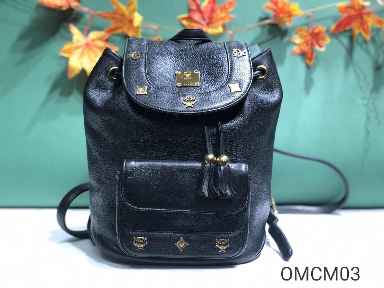 Vintage MCM Black Backpack With Golden Studded Logo Motifs and 