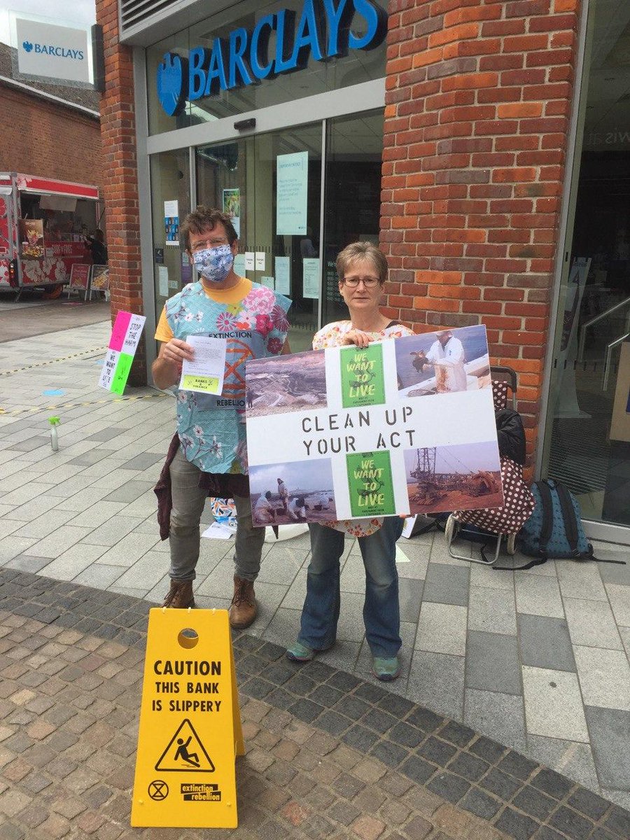 XR_Newbury's tweet photo. XR Newbury was peacefully protesting outside of the local @BarclaysUK branch today. 

Barclays is the worst bank in Europe for funding fossil fuel companies. 

They must STOP funding the #ClimateCrisis. 

Ask @Barclays to #CleanUpTheirAct. https://t.co/McQqXjfg0N