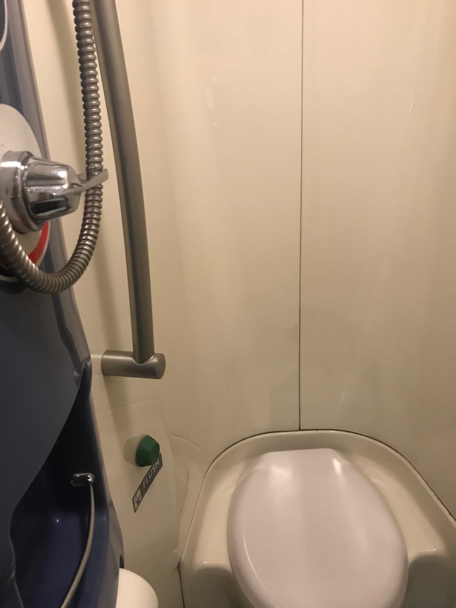 And that’s the shower/toilet setup. I was like “ewww the toilet is IN the shower?!” But I’d brought disinfectant wipes so I wiped down the whole thing. But as it turns out, having somewhere you can sit to wash your feet while showering on a moving train is handy.