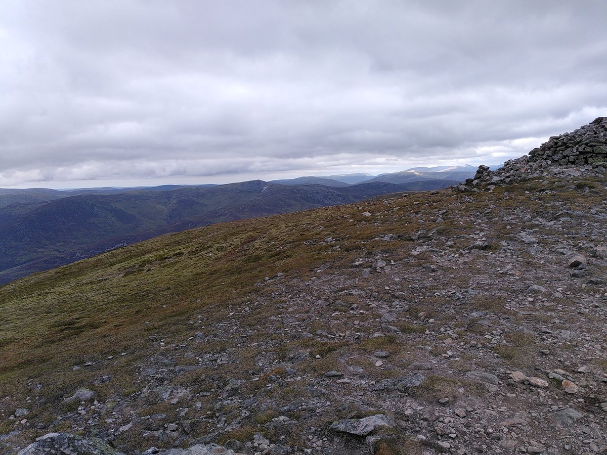 You join us for the latest edition of "name that hill". Here is the now orthodox photo from the four corners of the trig point atop the first Munro I bagged today. Nae prizes.